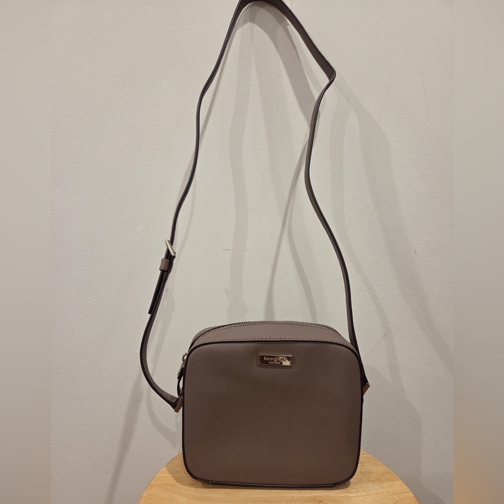 kate spade taupe crossbody bag with gold logo